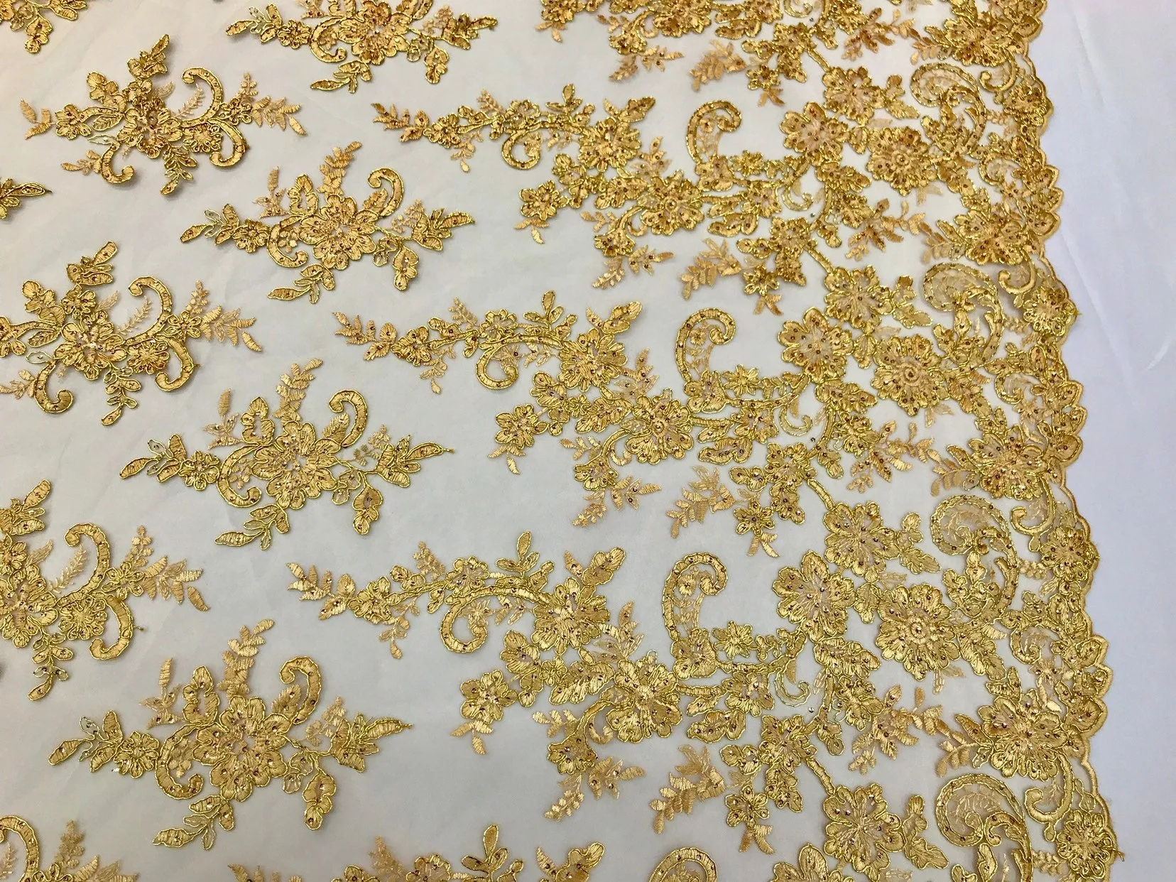 Metallic gold floral design embroidery on a mesh lace with sequins and cord-dresses-fashion-apparel-prom-nightgown-sold by the yard-