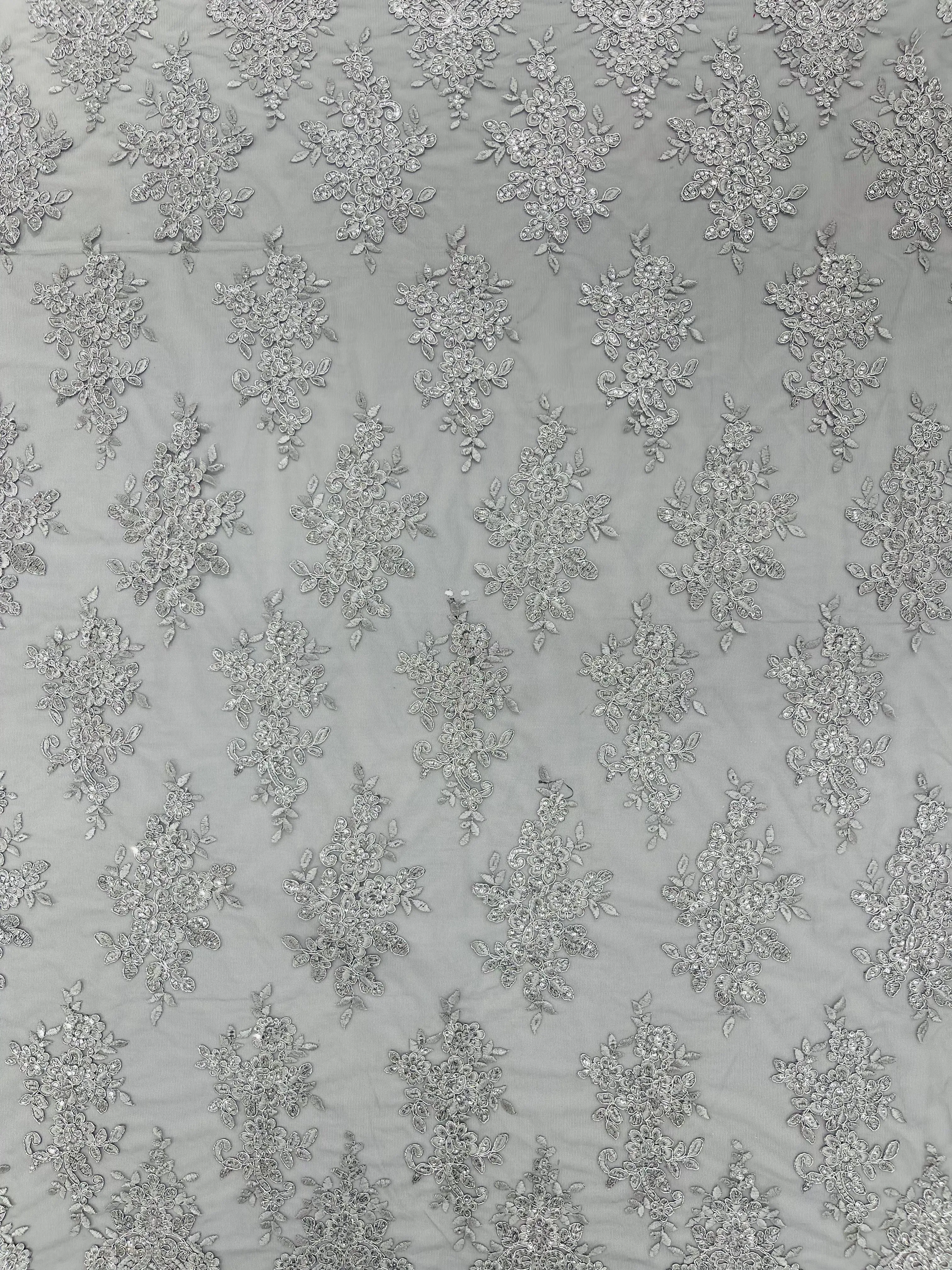 Silver Metallic corded embroider with sequins on a Black mesh lace fabric-prom-sold by the yard.