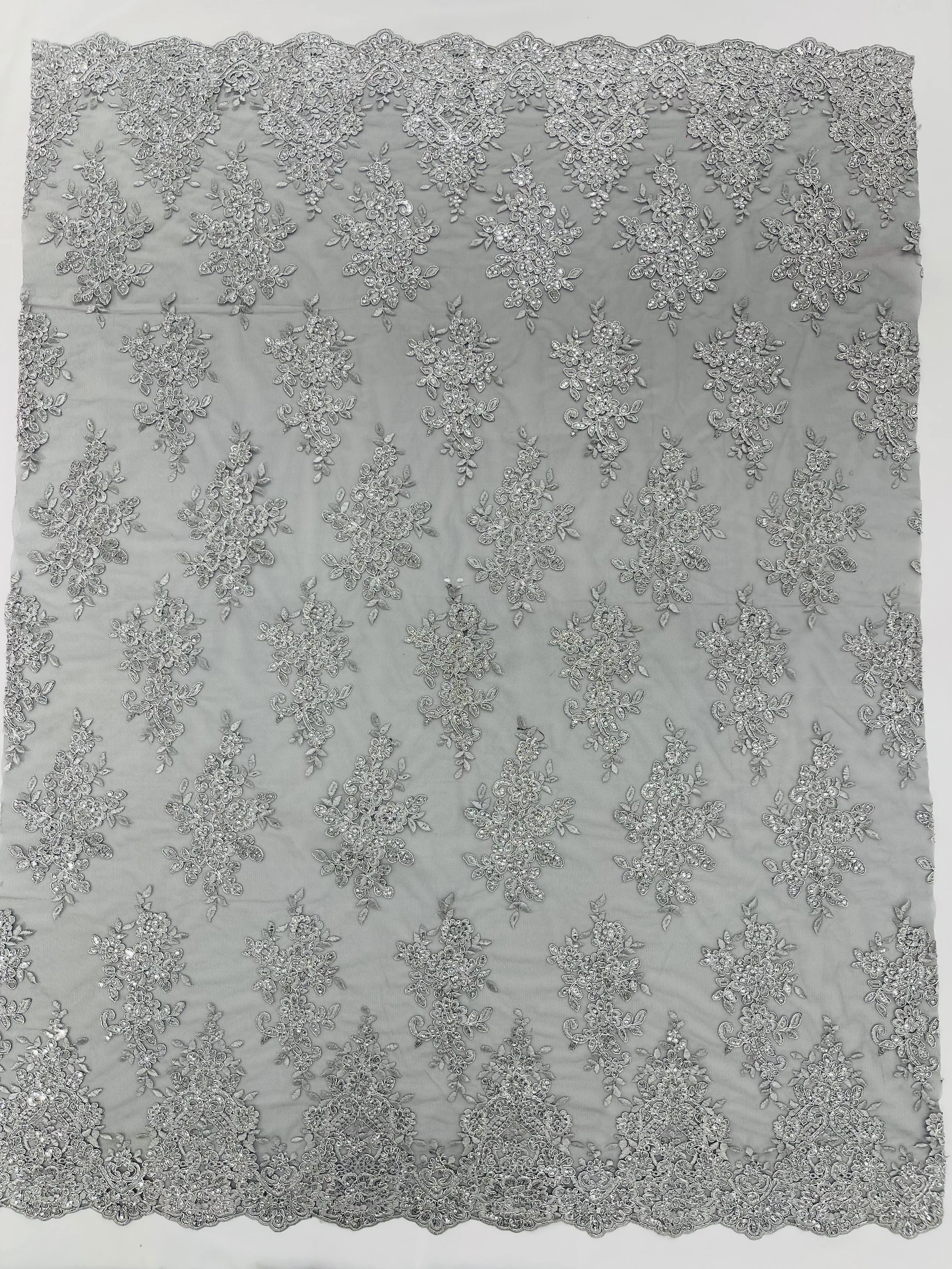 Silver Metallic corded embroider with sequins on a Black mesh lace fabric-prom-sold by the yard.